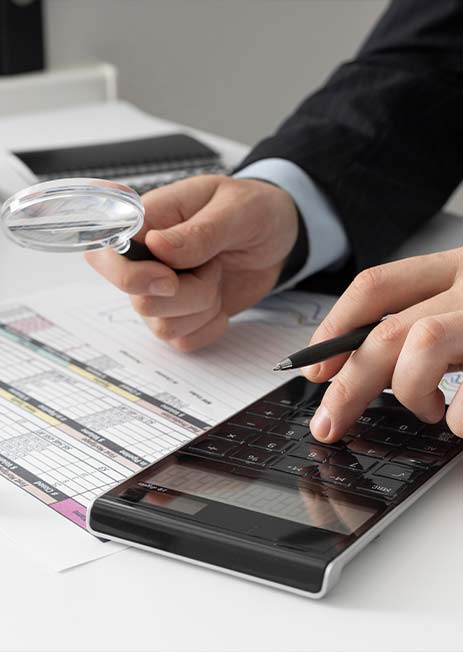 Man using calculator to calculate tax